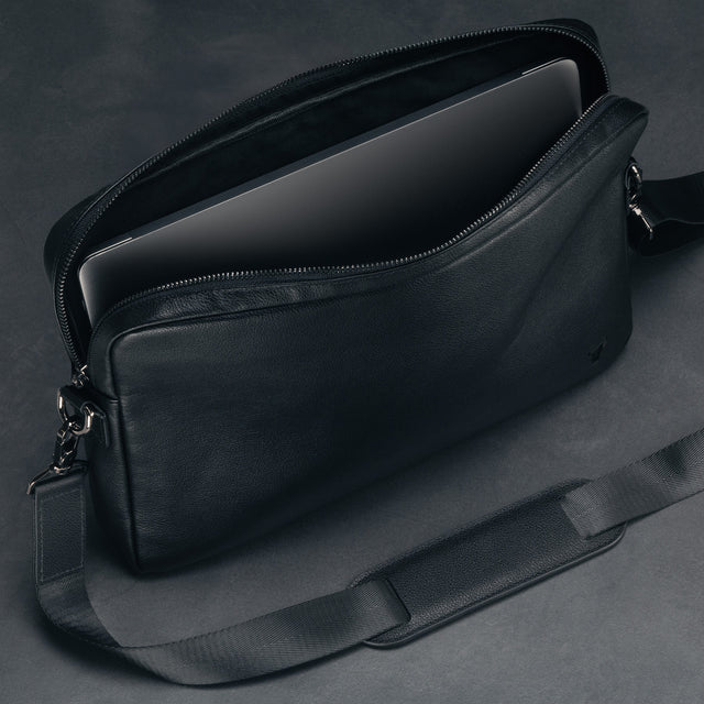 Protective leather flap on the inside of the Black Leather Messenger Bag