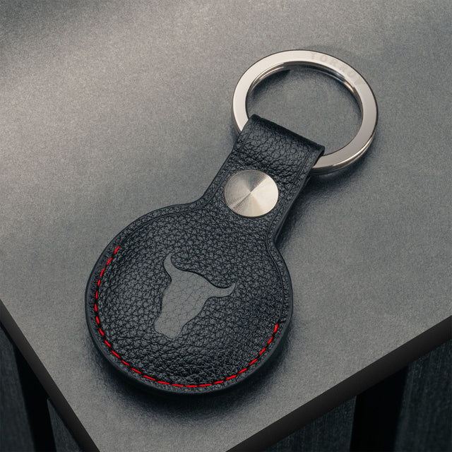 Back of the Black with Red Detail Leather Apple AirTag Holder Keyring showing the TORRO bulls head logo