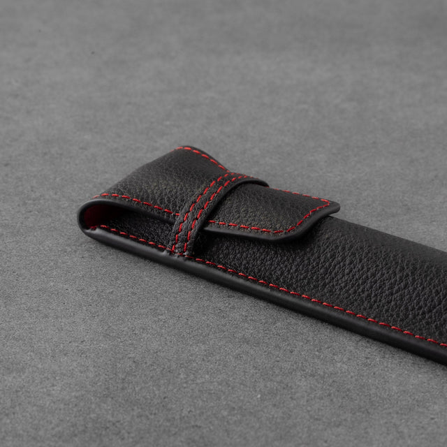 Leather closure flap of the Black with Red Stitching Leather Apple Pencil Case / Sleeve