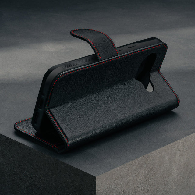 Stand feature of the Black with Red Detail Leather Wallet Case for Google Pixel 9