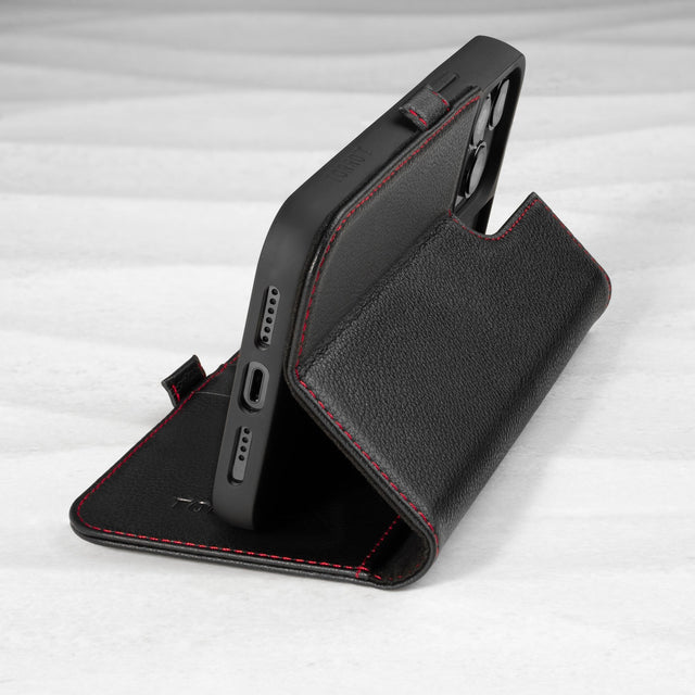 Integrated stand function of the Black (with Red Stitching) Leather Folio Stand Case for iPhone 14 Pro