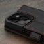 Camera cutout on the Black with Red Detail Leather Wallet Case for iPhone 15 Pro