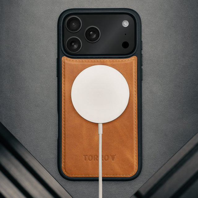 MagSafe charger attached to the Nubuck Dark Brown Detachable Case for iPhone 17 Pro
