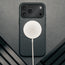MagSafe charger attached to the Slimline Black Leather Bumper Case for iPhone 17 Pro Max