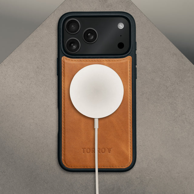 MagSafe charger attached to the Nubuck Blue Detachable Case for iPhone 17 Pro Max